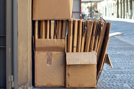 commercial junk removal: cardboard outside a store
